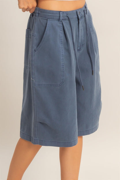 Navy jorts side view showing patch pocket