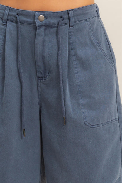 Close-up of navy jorts drawstring and hardware