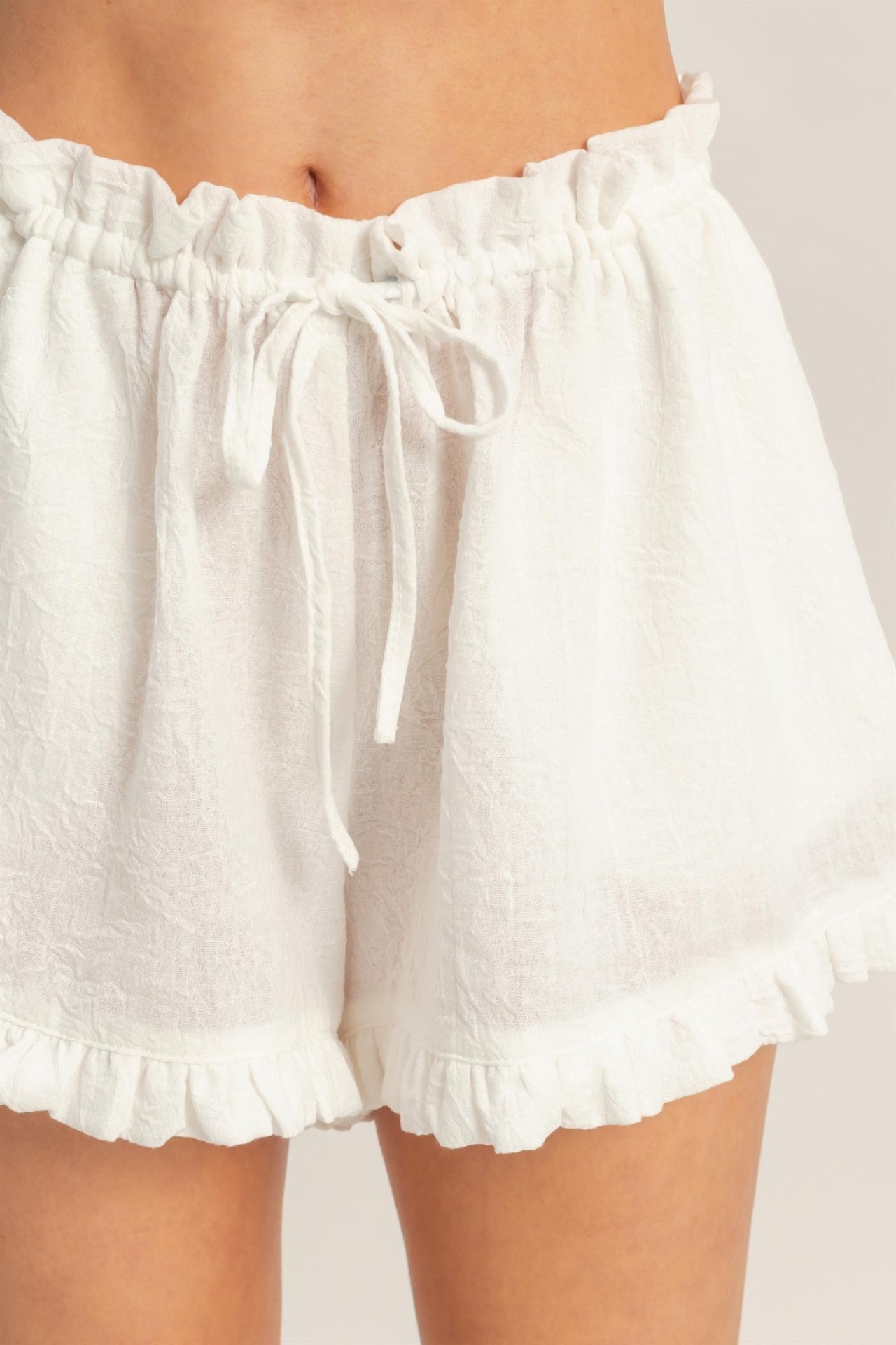 White Ruffle-Hem Drawstring Shorts — detail