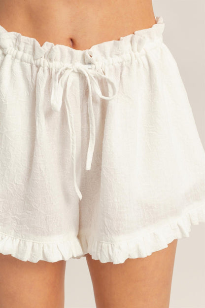 White Ruffle-Hem Drawstring Shorts — detail